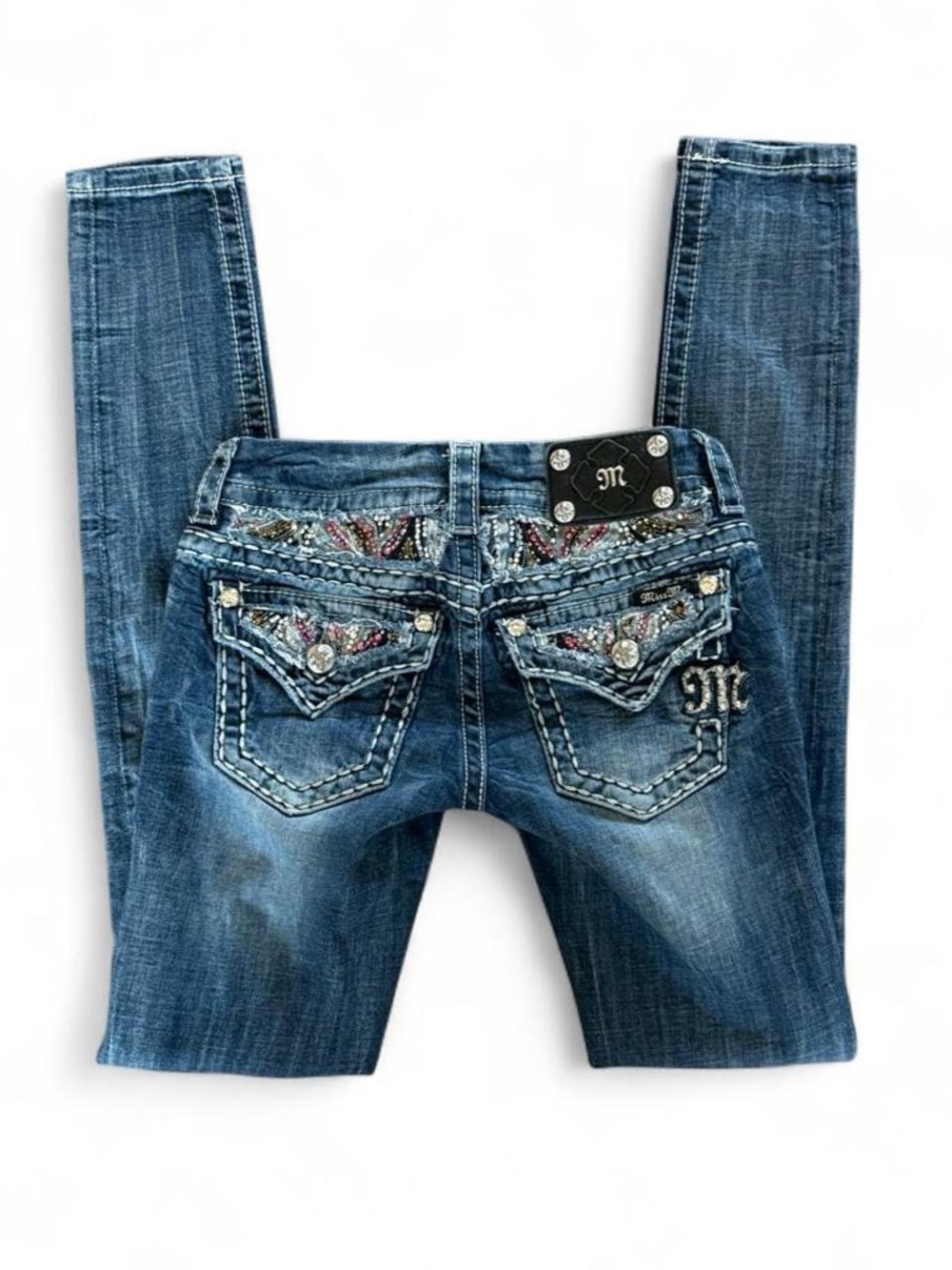 Miss Me blue low rise skinny jeans with silver studs and embroidery